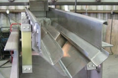 Specialized v-trough feeder to bean cutter